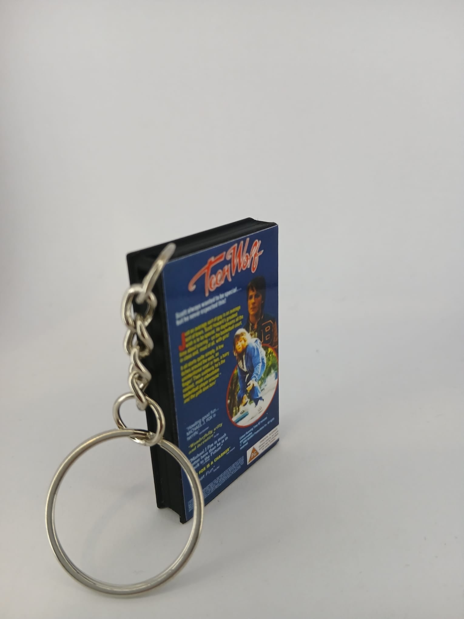 Teen Wolf VHS keyring — back and spine angled view standing