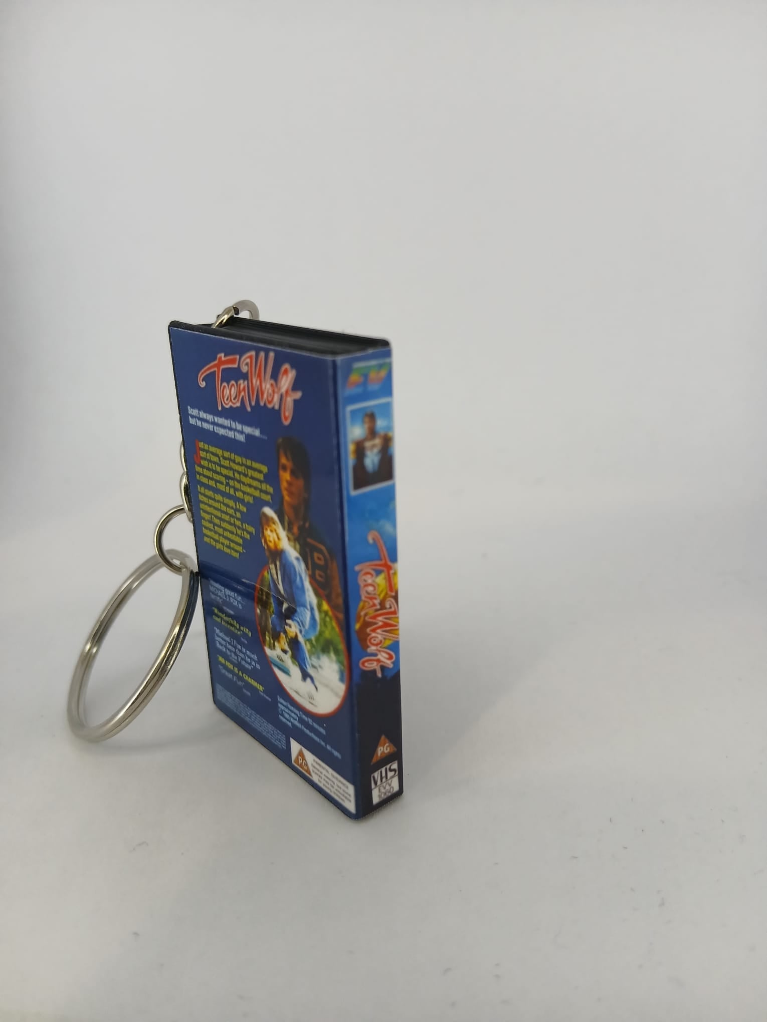 Teen Wolf VHS keyring — spine and front angled view standing
