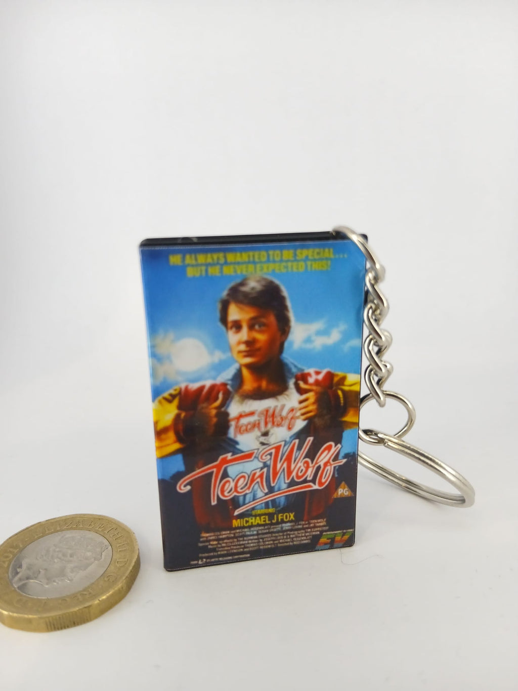 Teen Wolf VHS keyring — front cover standing with coin for scale