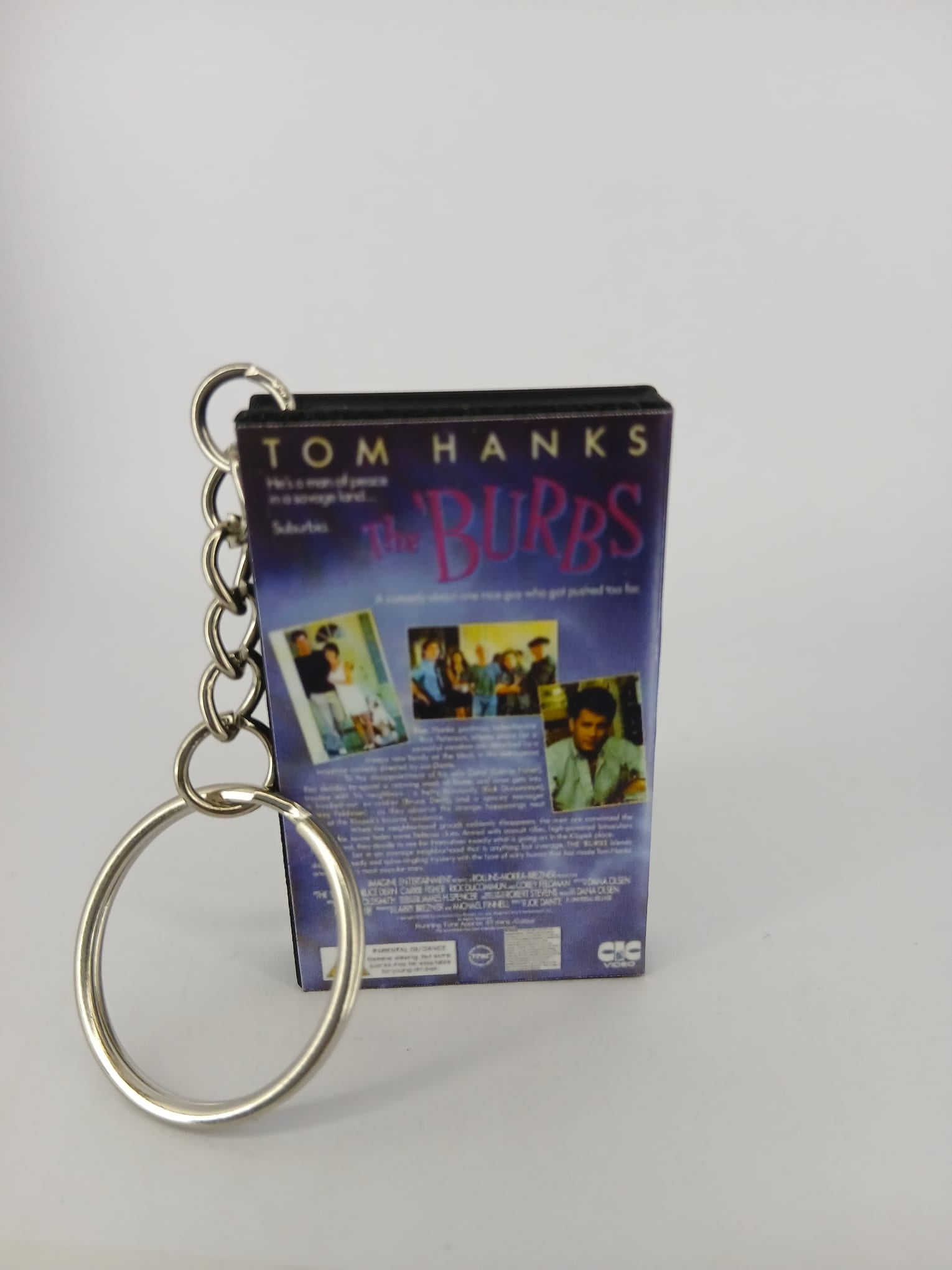 The 'Burbs VHS keyring — spine view standing