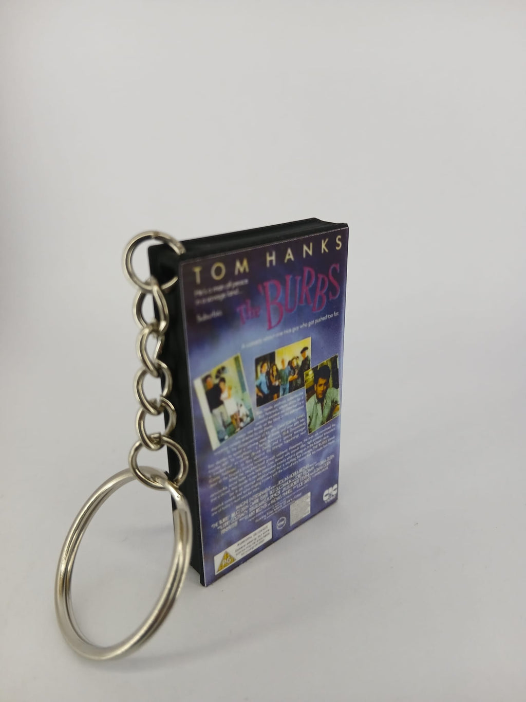 The 'Burbs VHS keyring — front cover flat lay angled 3