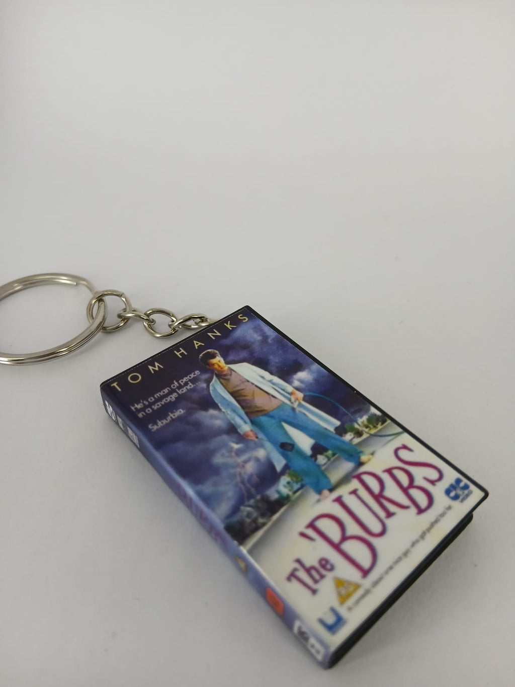 The 'Burbs VHS keyring — front cover flat lay angled 5