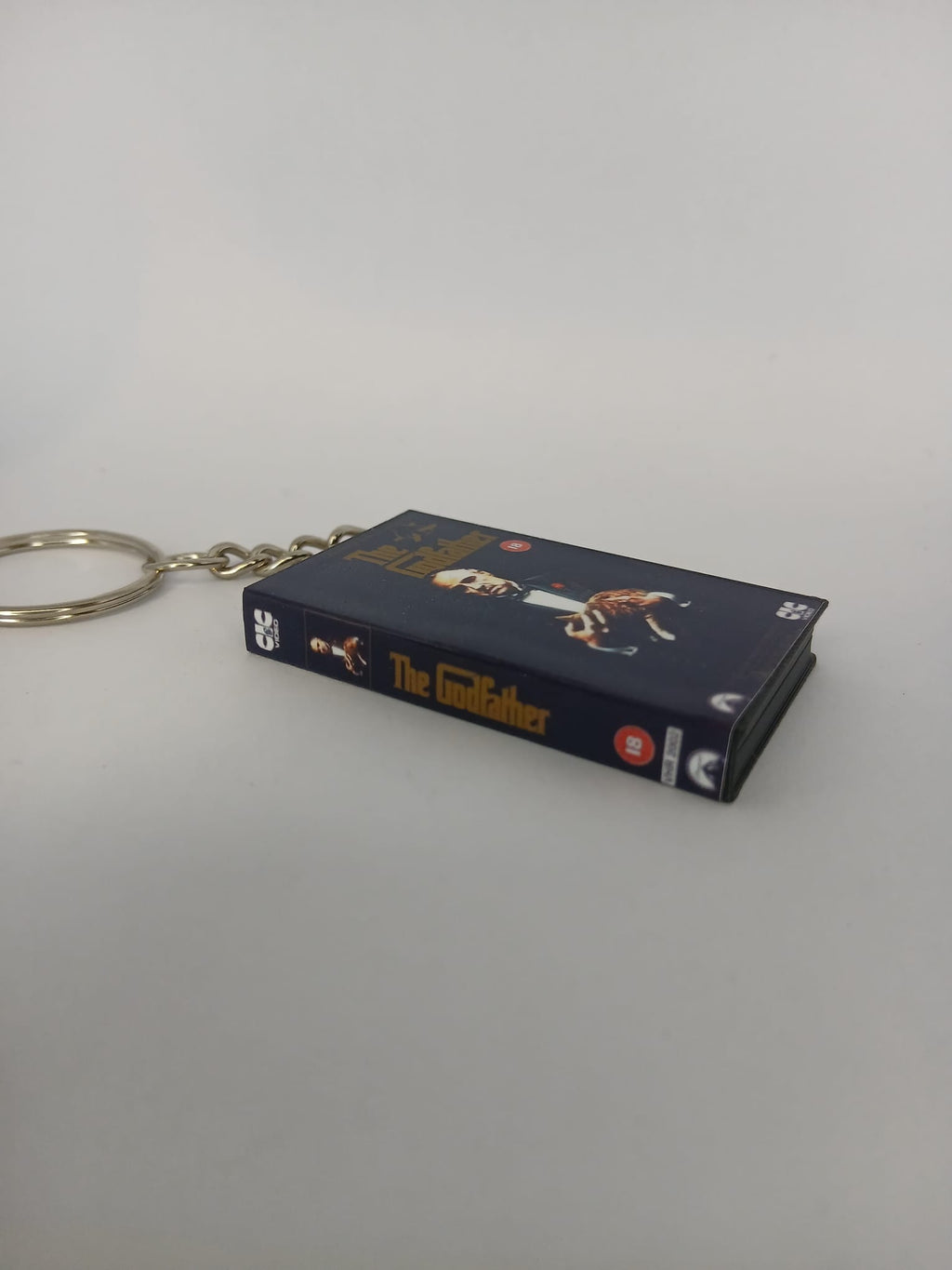 The Godfather Mini VHS Keyring – flat lay side angle