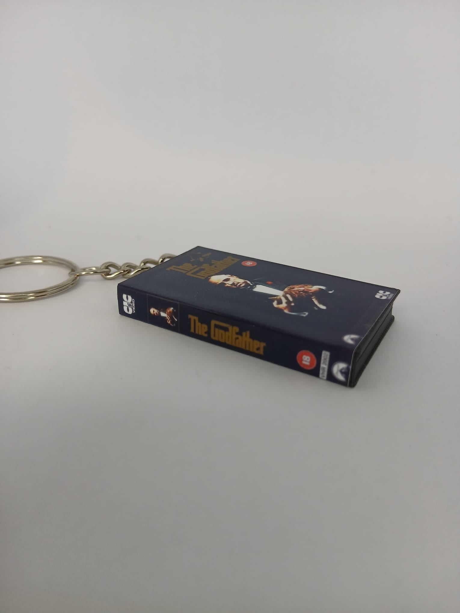 The Godfather Mini VHS Keyring – flat lay side angle