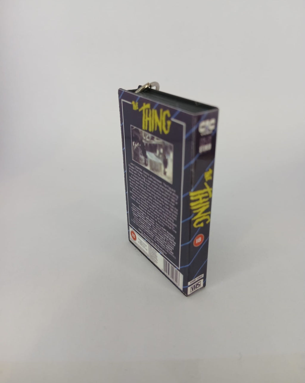 The Thing Mini VHS Keyring – flat lay front angle
