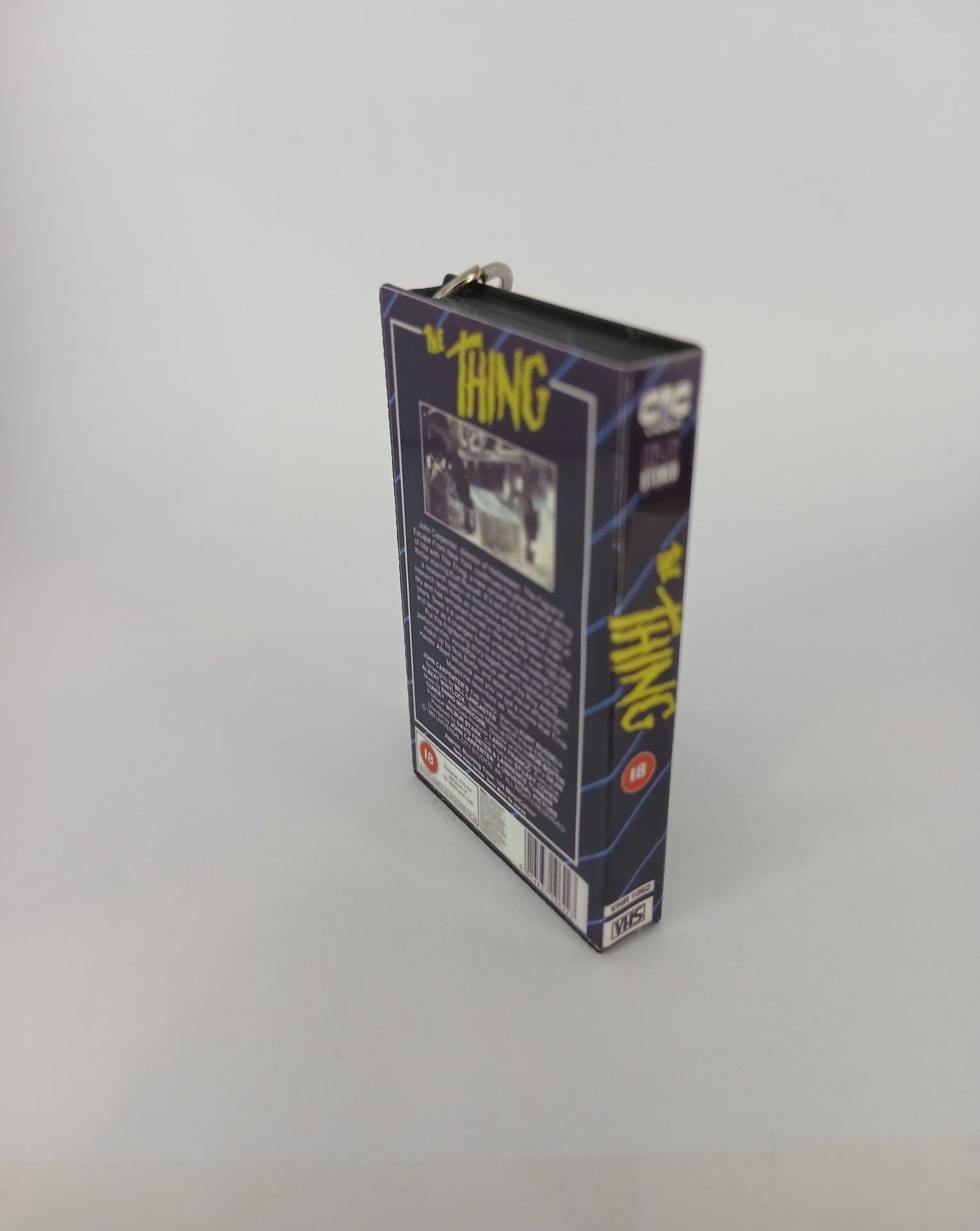 The Thing Mini VHS Keyring – flat lay front angle