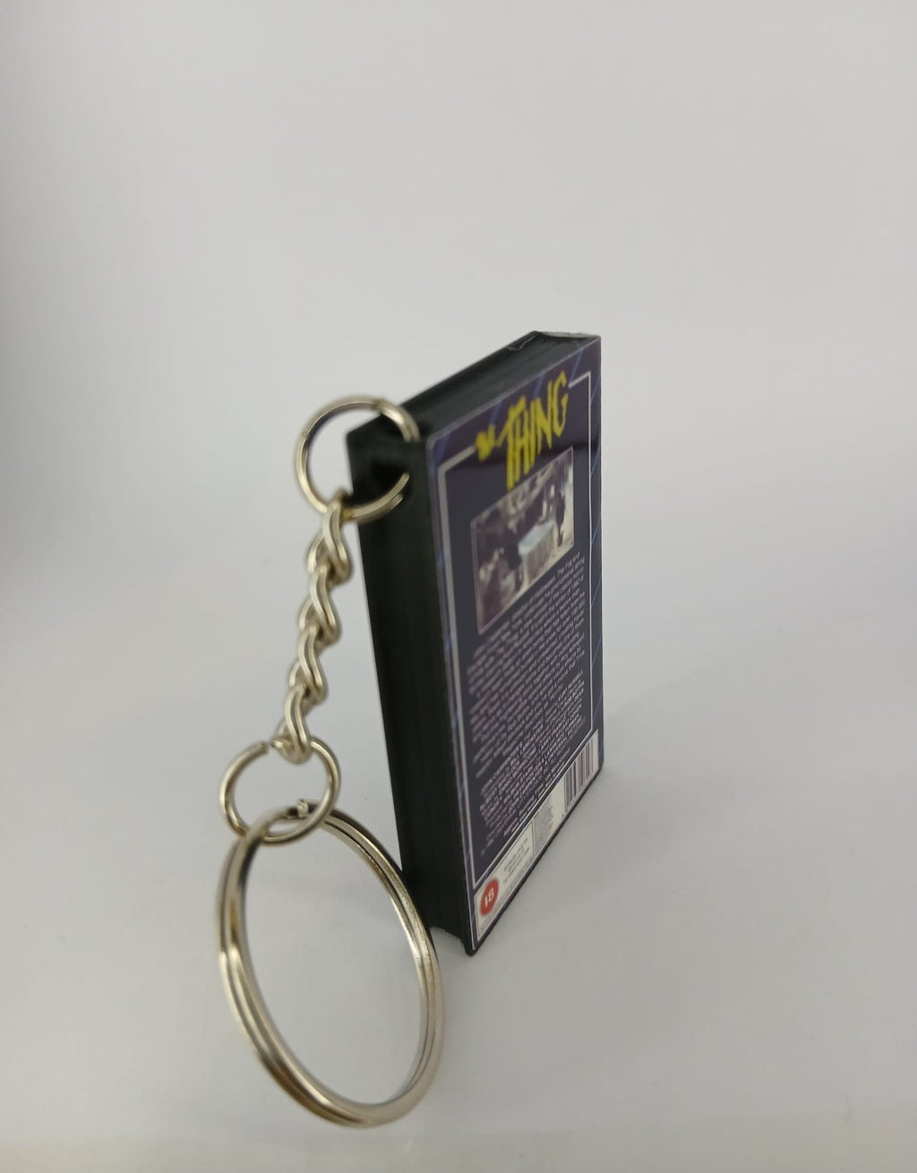 The Thing Mini VHS Keyring – front with coin