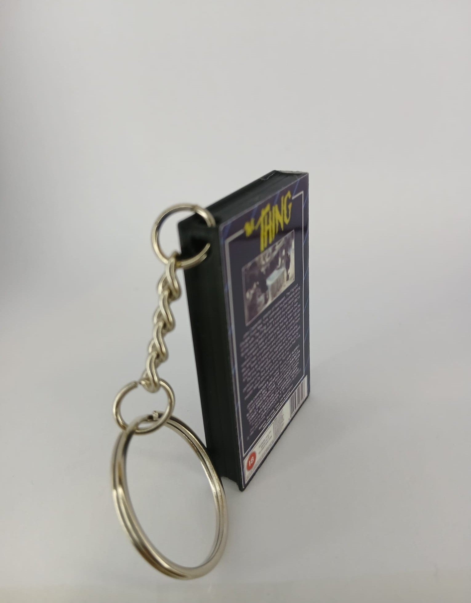 The Thing Mini VHS Keyring – front with coin