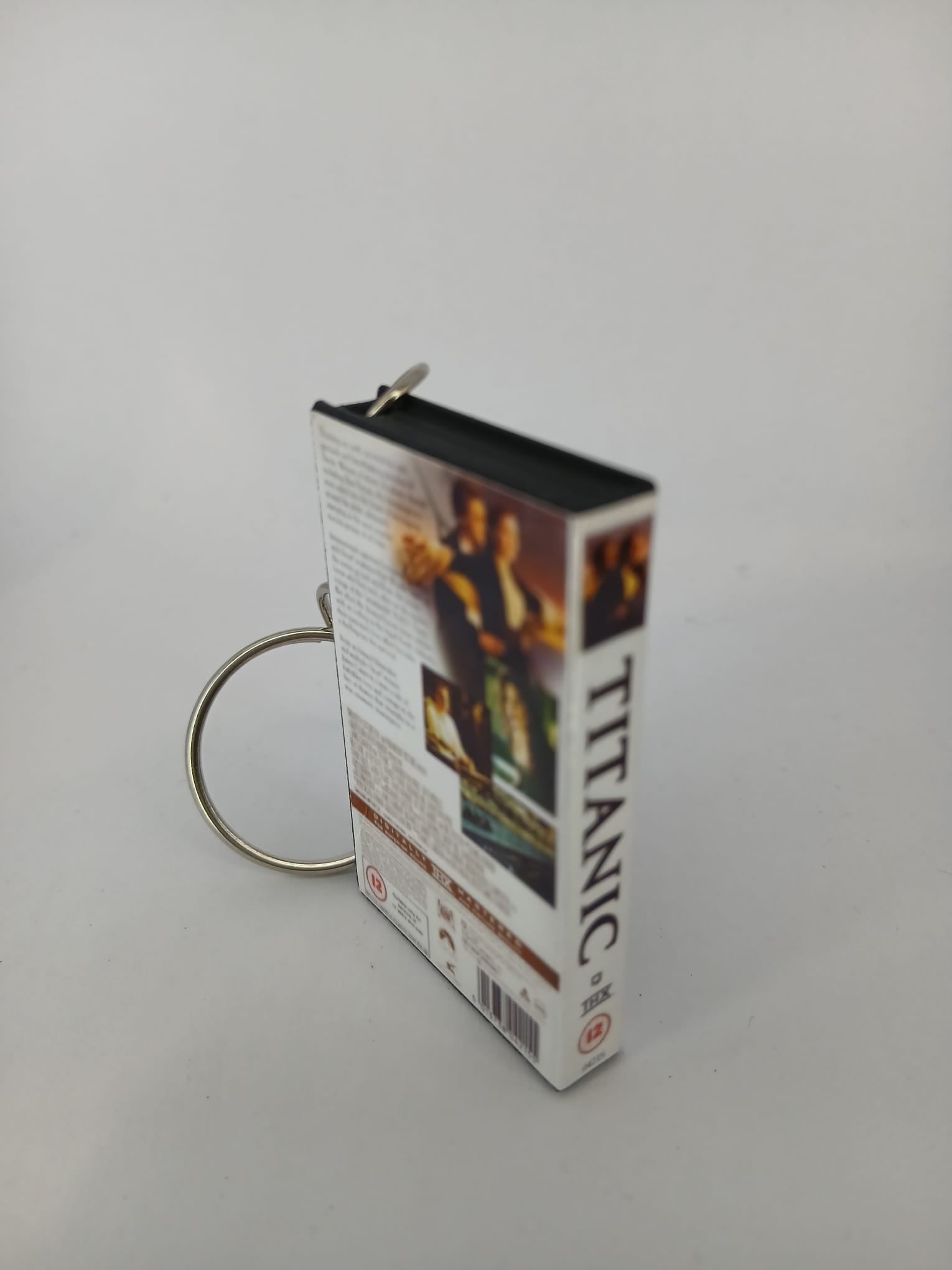 Titanic VHS keyring — spine view standing