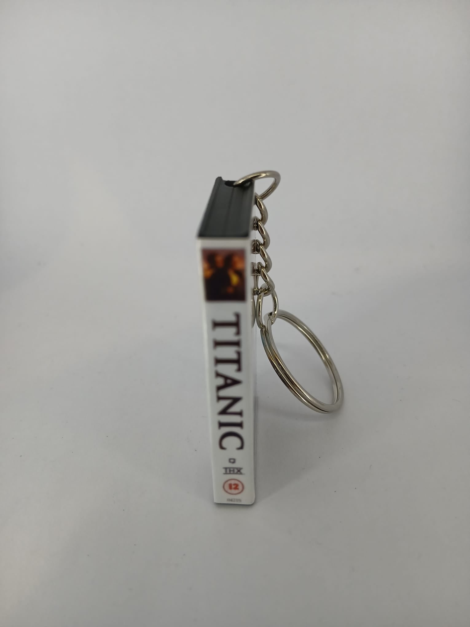 Titanic VHS keyring — back and spine angled view standing 2