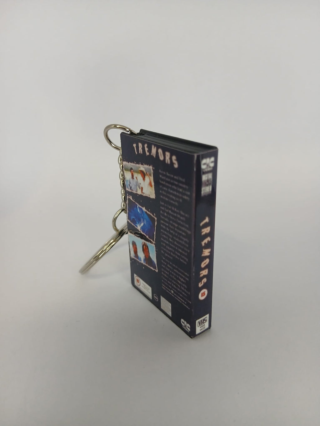 Tremors Mini VHS Keyring – spine view standing