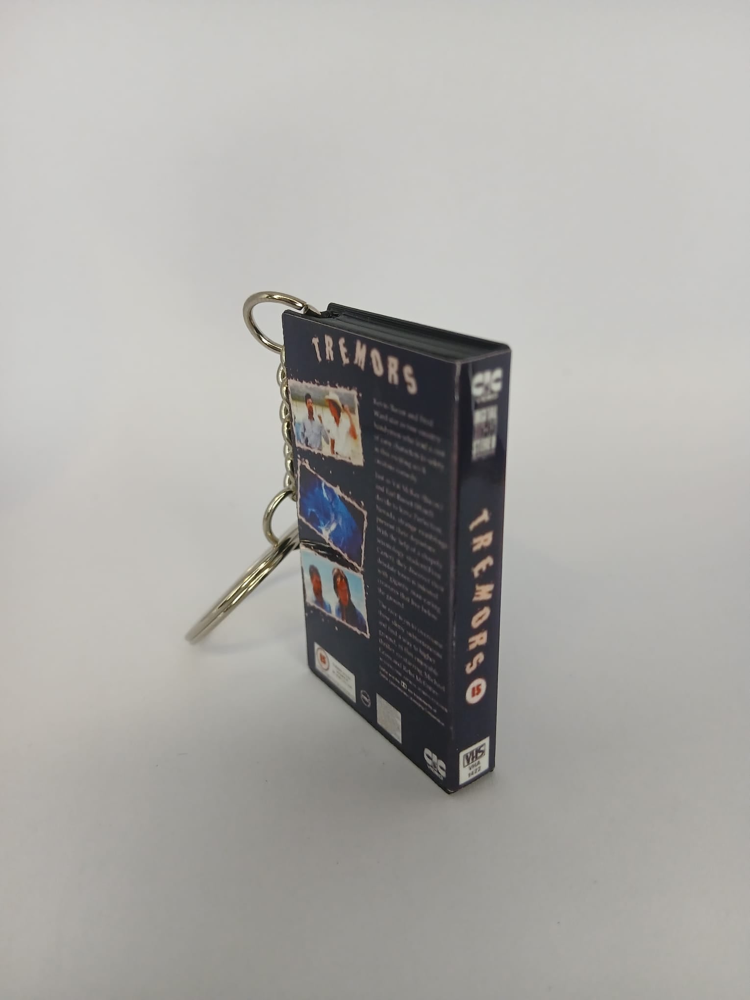 Tremors Mini VHS Keyring – spine view standing