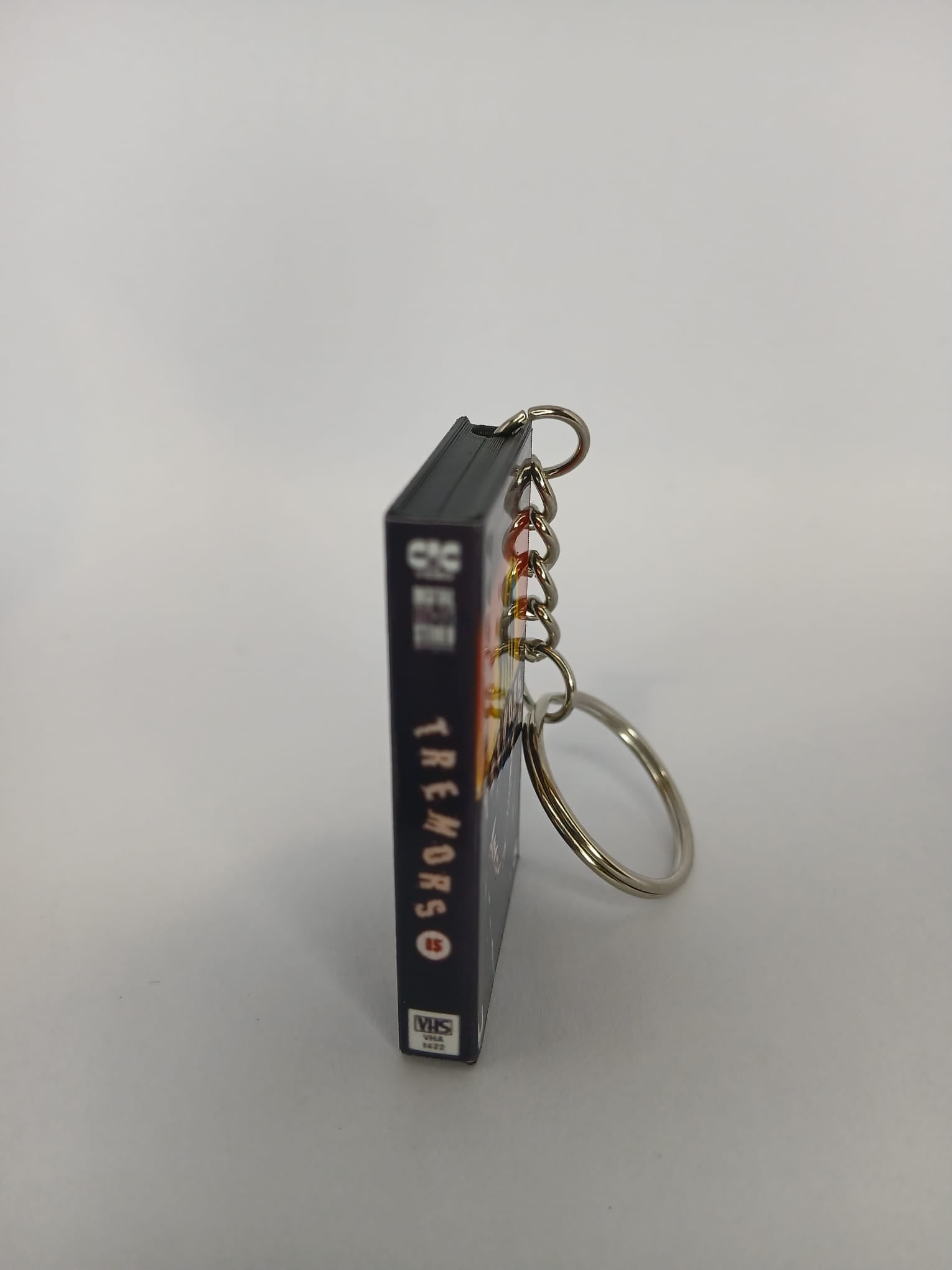 Tremors Mini VHS Keyring – front spine angle standing