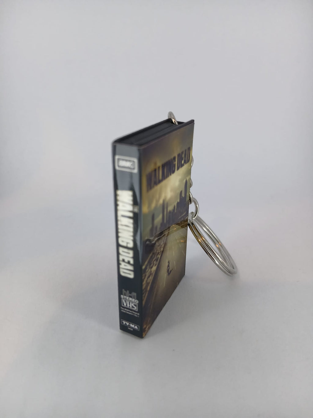 The Walking Dead VHS keyring — back cover standing angled