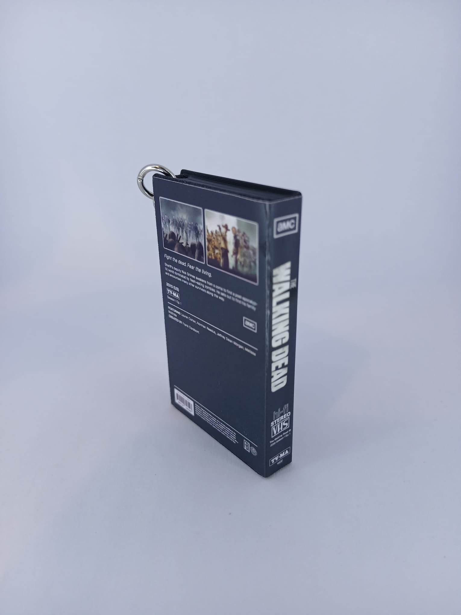 The Walking Dead VHS keyring — front and spine flat lay angled