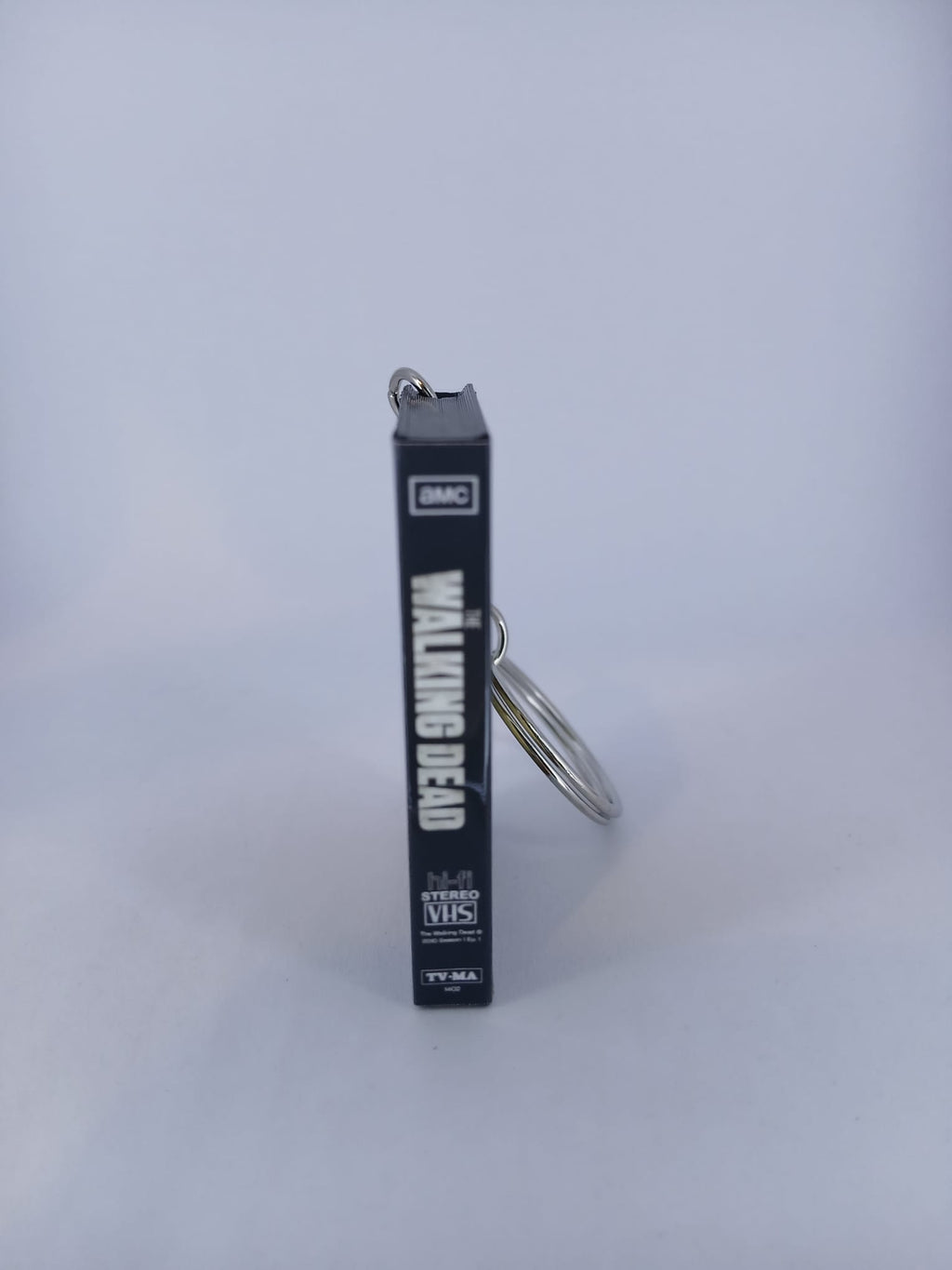 The Walking Dead VHS keyring — front cover standing angled